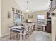 Dining area featuring a large table, seating for six, and natural light at 380 Morning Glory Dr, Lake Mary, FL 32746