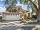 Charming two-story home featuring a two car garage, neutral color palette, and a well-manicured front yard at 380 Morning Glory Dr, Lake Mary, FL 32746