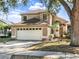 Charming two-story home featuring a two car garage, neutral color palette, and a well-manicured front yard at 380 Morning Glory Dr, Lake Mary, FL 32746