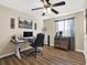 Office space with hardwood floors, a modern desk, and a comfortable chair at 380 Morning Glory Dr, Lake Mary, FL 32746