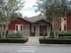 Arlington Ridge Activity Center features beautiful landscaping and a welcoming entrance with double doors and stone accents at 4110 Arlington Ridge Blvd, Leesburg, FL 34748