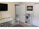 Bedroom featuring a sleek desk, television, shelving and carpeted floors at 4110 Arlington Ridge Blvd, Leesburg, FL 34748