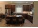 Bright kitchen featuring granite countertops, a stylish island, and stainless steel appliances at 4110 Arlington Ridge Blvd, Leesburg, FL 34748