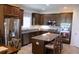 This spacious kitchen has stainless steel appliances, granite countertops, and ample cabinet space at 4110 Arlington Ridge Blvd, Leesburg, FL 34748