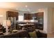 Open floor plan, kitchen and living room featuring modern furniture and decor at 4110 Arlington Ridge Blvd, Leesburg, FL 34748