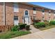 Charming brick two-story townhouse with well-maintained landscaping and a welcoming front entrance at 4376 Lake Underhill Rd # C, Orlando, FL 32803