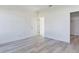 Spacious bedroom with wood-look floors and access to closet/ensuite at 4415 Sw 169Th Lane Rd, Ocala, FL 34473