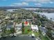 This aerial shows a beautiful waterfront property with dock and pool overlooking Lake Osceola at 443 Lakewood Dr, Winter Park, FL 32789