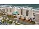 Stunning aerial view of oceanfront condo building with manicured landscaping and convenient parking at 4495 S Atlantic Ave # 5020, Ponce Inlet, FL 32127