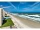 Expansive beach view with access to a private pool and lounging area for residents at 4495 S Atlantic Ave # 5020, Ponce Inlet, FL 32127