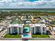 Beautiful aerial view of the beachfront condo complex with a pool and tennis courts at 4495 S Atlantic Ave # 5020, Ponce Inlet, FL 32127