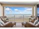 Outdoor balcony featuring wicker seating with plush cushions overlooking the ocean at 4495 S Atlantic Ave # 5020, Ponce Inlet, FL 32127