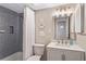 Charming bathroom featuring a shower with gray tile, a vanity, and beach-themed decor at 4495 S Atlantic Ave # 5020, Ponce Inlet, FL 32127