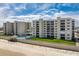 Aerial view of residential buildings by the beach with a pool at 4495 S Atlantic Ave # 5020, Ponce Inlet, FL 32127