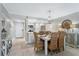 Dining area with wood table and seating with an open layout to the kitchen at 4495 S Atlantic Ave # 5020, Ponce Inlet, FL 32127