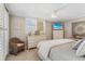 Bright, well-decorated bedroom with television and dresser, offers a relaxing retreat at 4495 S Atlantic Ave # 5020, Ponce Inlet, FL 32127