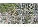 Aerial view of a neighborhood with residential homes, green spaces, and well-planned streets at 48 Carriage Hill Cir, Casselberry, FL 32707