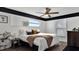 Bright bedroom with a ceiling fan, black painted trim, and natural light at 48 Carriage Hill Cir, Casselberry, FL 32707