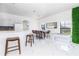 Bright and open dining area featuring modern decor, seating for six, and a game table at 502 Summer Place Loop, Clermont, FL 34714