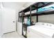 Organized laundry room with shelving, storage, and modern appliances for efficient chores at 502 Summer Place Loop, Clermont, FL 34714