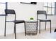 Minimalistic study room featuring two modern chairs and an accent table by the window at 502 Summer Place Loop, Clermont, FL 34714