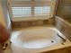 A large bathtub with tile surround and window at 527 Buckhaven Loop, Ocoee, FL 34761