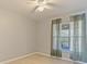 Neutral bedroom with natural light, ceiling fan and tile flooring at 527 Buckhaven Loop, Ocoee, FL 34761