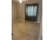 A well-lit bedroom with tile flooring, neutral walls and a window at 527 Buckhaven Loop, Ocoee, FL 34761