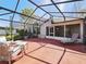 View of screened-in patio featuring outdoor seating and view of the house at 527 Buckhaven Loop, Ocoee, FL 34761