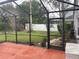 Beautiful outdoor screened-in patio overlooking the yard, providing a tranquil space for relaxation and entertainment at 527 Buckhaven Loop, Ocoee, FL 34761