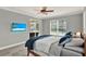 Main bedroom featuring sliding glass doors to lanai, ceiling fan and lots of natural light at 558 Osprey Lakes Cir, Chuluota, FL 32766