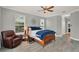 Main bedroom featuring hard surface flooring, ceiling fan and a comfy chair at 558 Osprey Lakes Cir, Chuluota, FL 32766