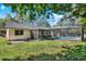 Backyard view featuring a screened pool and covered patio at 600 Heather Brite Cir, Apopka, FL 32712