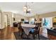 Inviting dining room featuring hardwood floors, fireplace, and sliding glass doors to the backyard at 600 Heather Brite Cir, Apopka, FL 32712