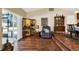 Open concept dining room with beautiful wood floors, slider to outside, and vintage display cabinet at 600 Heather Brite Cir, Apopka, FL 32712