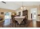 Bright dining room with vaulted ceiling, wood floors, sliding glass door to the pool and backyard at 600 Heather Brite Cir, Apopka, FL 32712