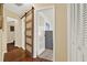 Hallway featuring a sliding barn door entrance with wood laminate flooring at 600 Heather Brite Cir, Apopka, FL 32712