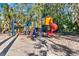 Community playground with a slide, multiple ladders, and climbing apparatus surrounded by mature trees at 600 Heather Brite Cir, Apopka, FL 32712