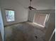 Bedroom featuring carpeted floors, ceiling fan, and natural light from windows at 8040 Equitation Ct, Orlando, FL 32818