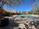 View of community pool with plenty of lounge chairs at 8801 Villa View Cir # 207, Orlando, FL 32821