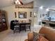 Dining area featuring tile floors, a ceiling fan, and easy access to the kitchen and living spaces at 9329 Dearmont Ave, Orlando, FL 32825