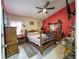 Cozy main bedroom with a ceiling fan, tiled floors, and matching wooden furniture at 9329 Dearmont Ave, Orlando, FL 32825