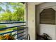 Balcony with seating and views of green space and neighboring building at 1000 Winderley Pl # 237, Maitland, FL 32751