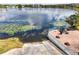 Scenic lake view from a community patio featuring lounge area at 1000 Winderley Pl # 237, Maitland, FL 32751