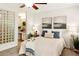 Comfortable primary bedroom with carpeted floors, ensuite bathroom, and decorative accents at 1000 Winderley Pl # 237, Maitland, FL 32751