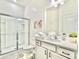 Bright bathroom with a glass-enclosed shower, white vanity, and modern decor for a clean and contemporary design at 10012 Voyager Way, Orlando, FL 32821