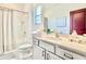 Bright bathroom featuring a single sink vanity, and shower over tub combination at 10012 Voyager Way, Orlando, FL 32821