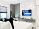 Stylish bedroom with a wall-mounted TV, floating drawers, and large windows at 10012 Voyager Way, Orlando, FL 32821