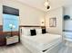 Cozy bedroom with a stylish lamp, bedside table, and a comfortable queen bed at 10012 Voyager Way, Orlando, FL 32821