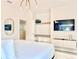 Modern bedroom showcases a television, closet system, and a modern chandelier at 10012 Voyager Way, Orlando, FL 32821